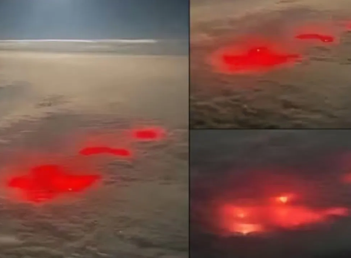 a brilliant red light in the Pacific Ocean.
